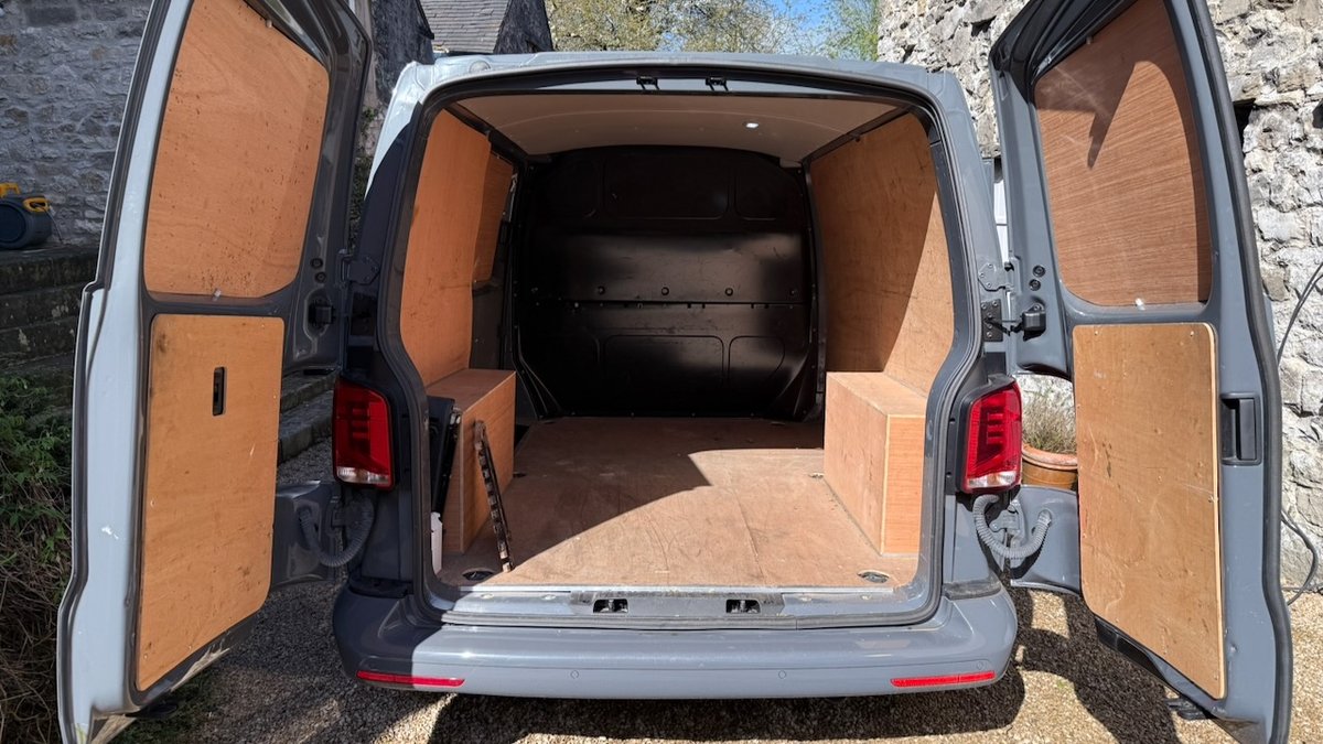 VW Transporter T6.1 interior with original ply lining — before strip out